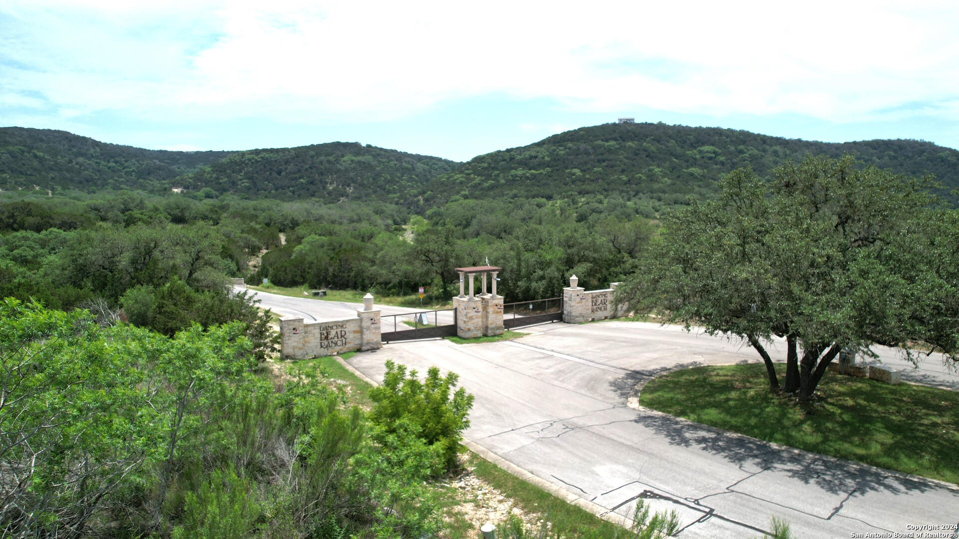 a view of a house with mountain view and a garden