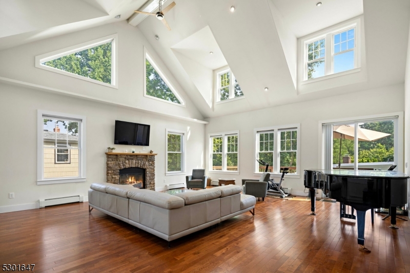 a living room with furniture fireplace and a flat screen tv