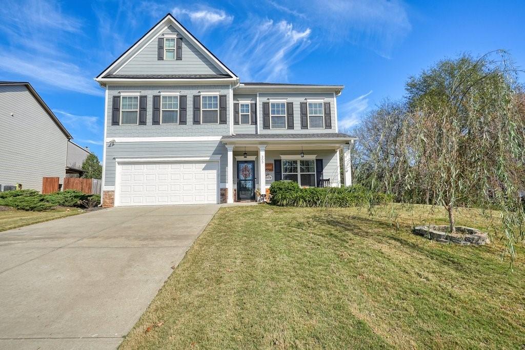 a front view of a house with a yard