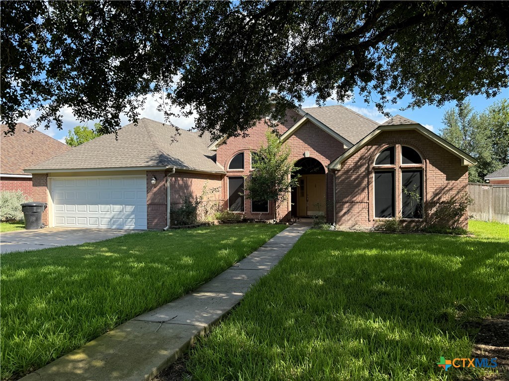 front view of a house with a yard