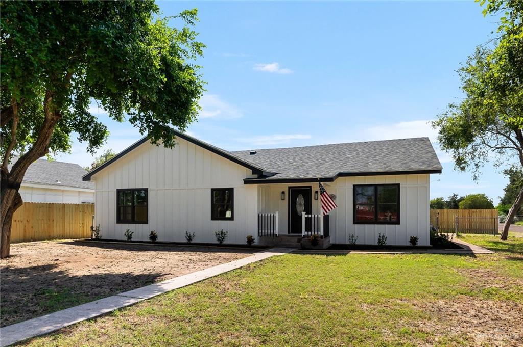 a view of house with yard