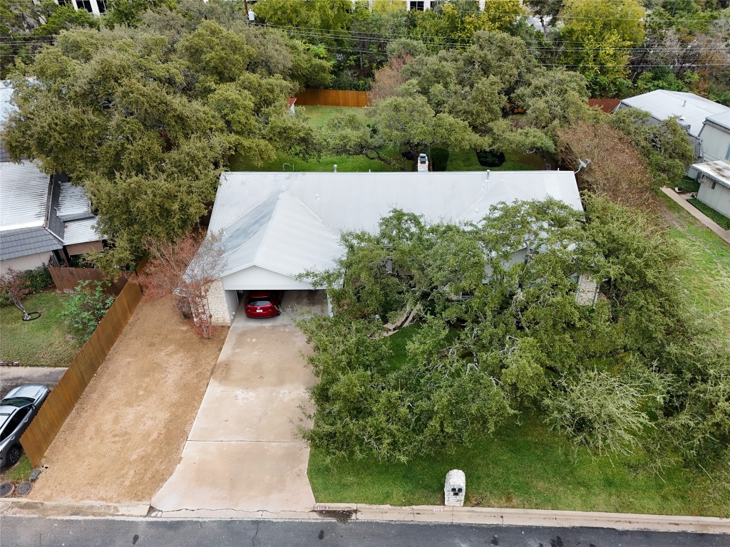 an aerial view of a house with yard