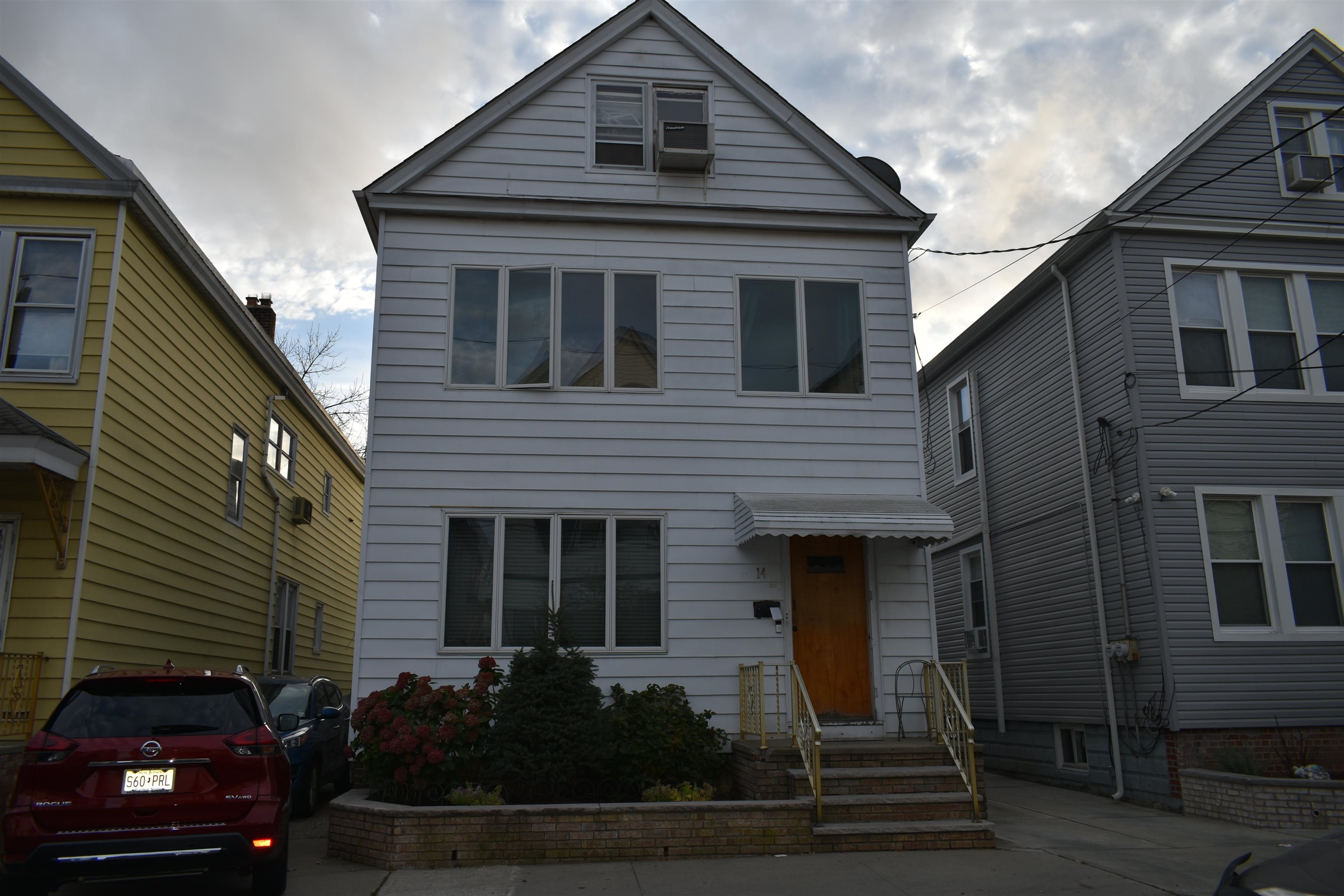 a front view of a house with garage