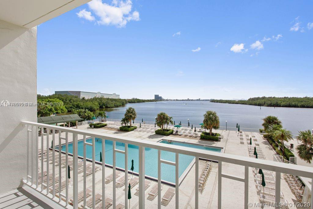 a view of a balcony with an outdoor seating