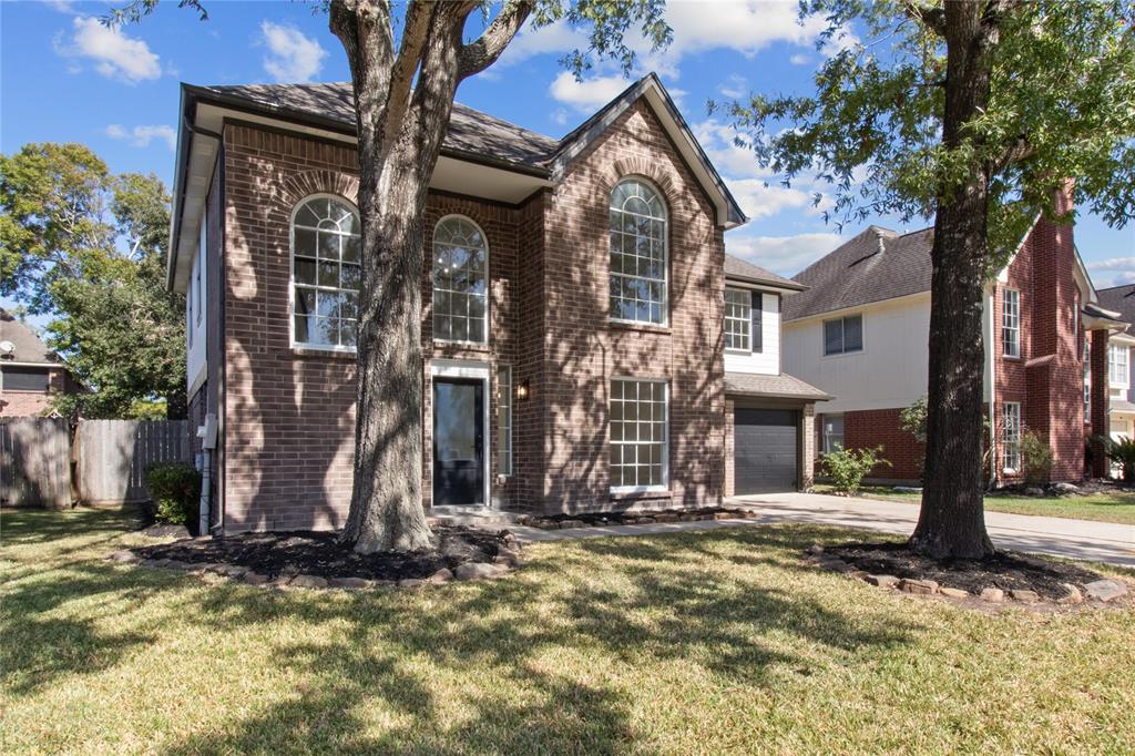 a view of a house with tree s