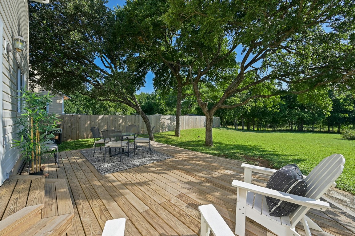 Imagine starting your day off with a cup of coffee on this beautiful back deck, over looking your private almost 1/2 acre lot, in the heart of highly-desirable Milwood neighborhood.