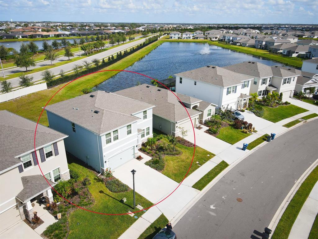 an aerial view of a house with a ocean view