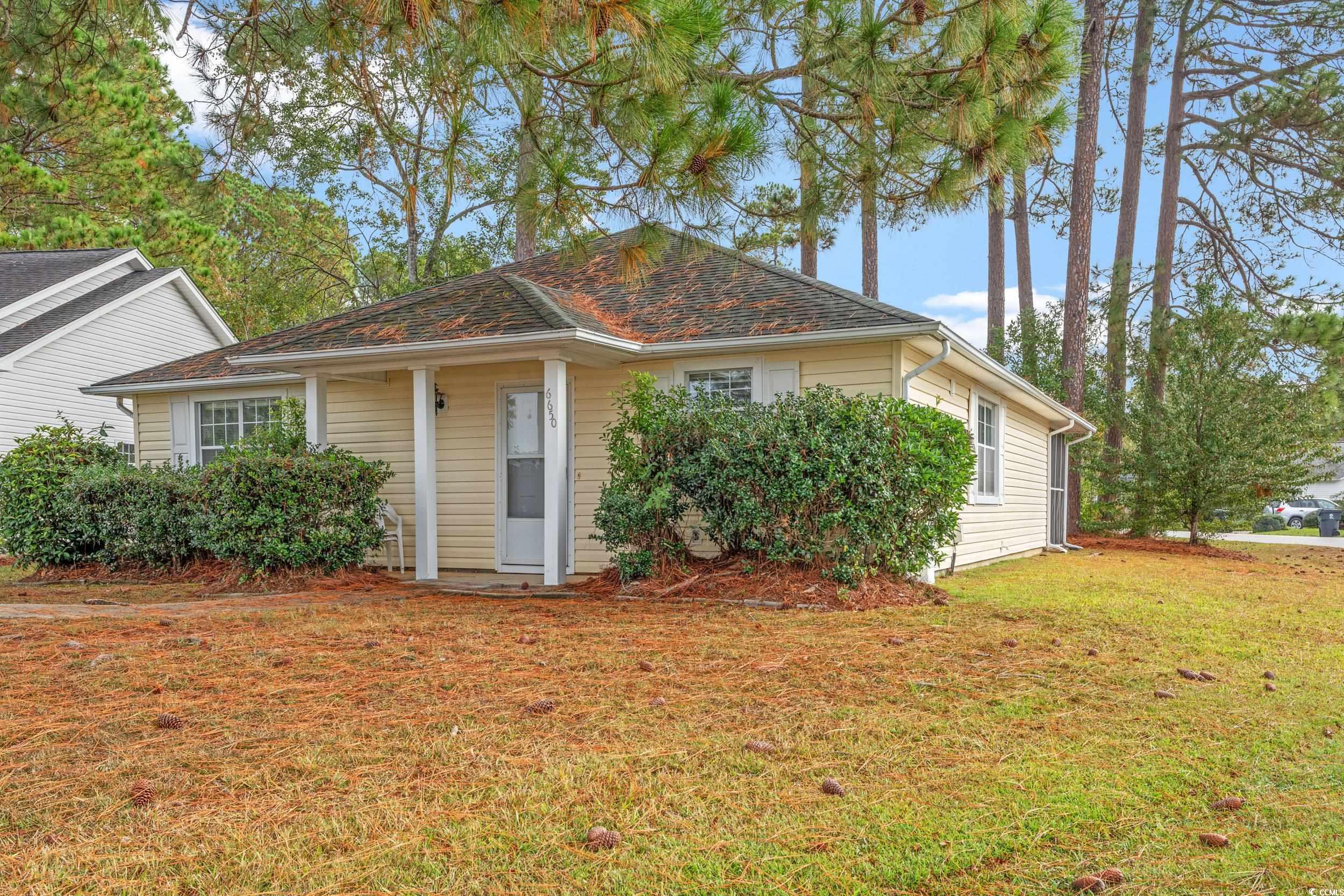 Bungalow-style house with a front lawn