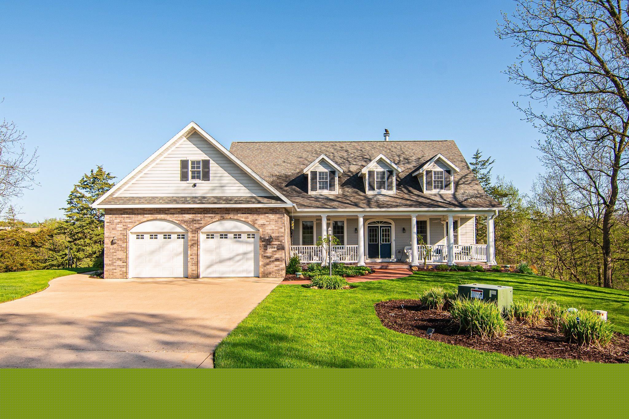 front view of a house with a yard