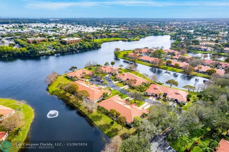 an aerial view of a house with a lake view