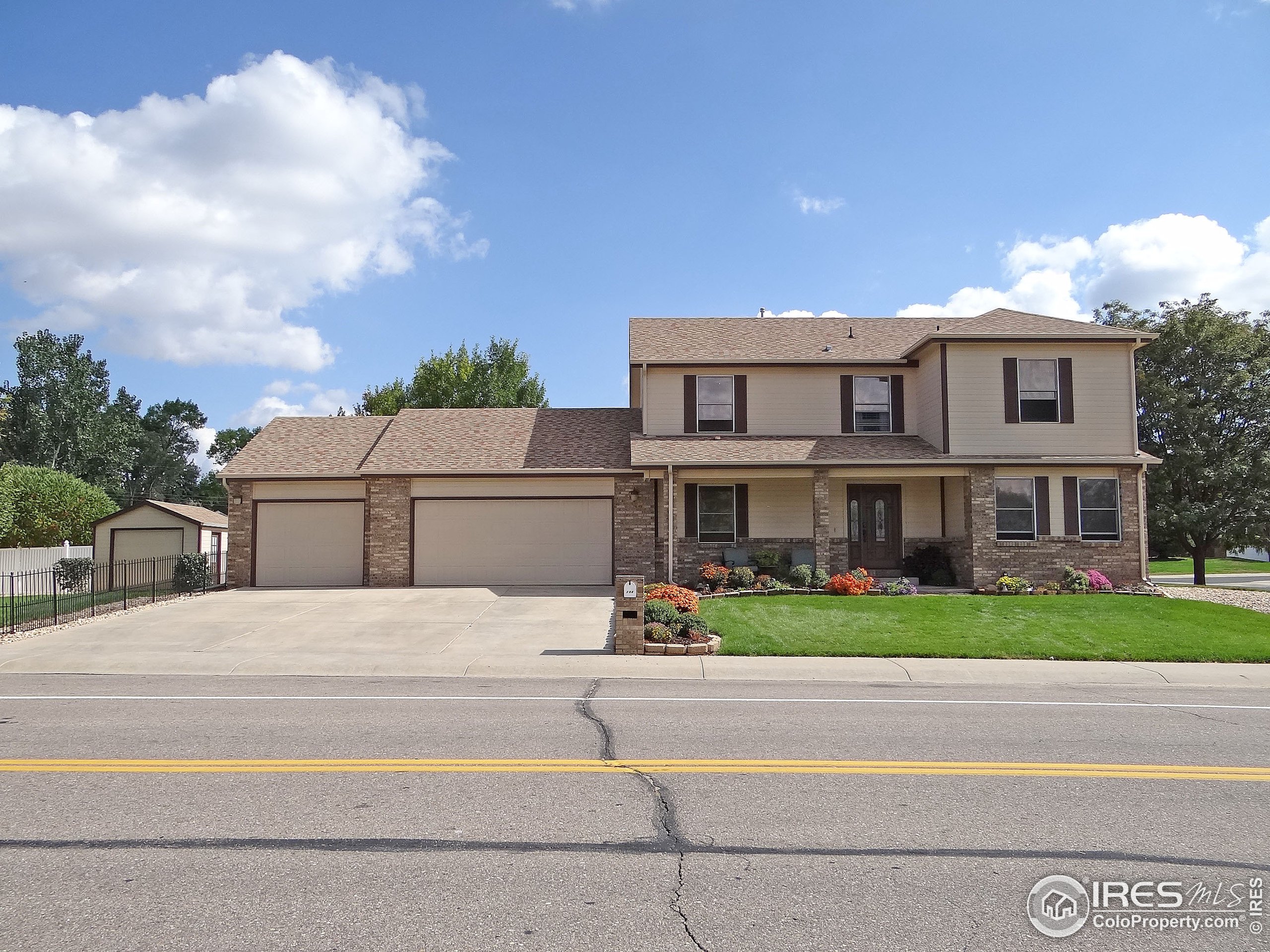 a view of house with outdoor space and street view