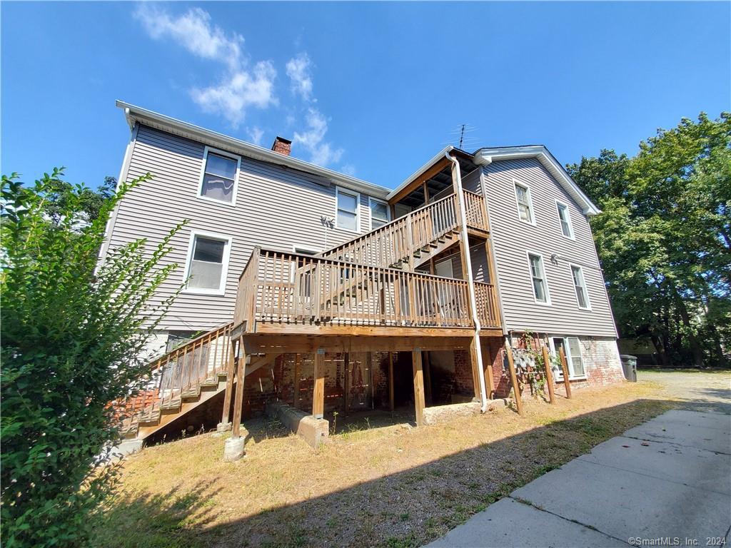 a front view of a house with a balcony and garage