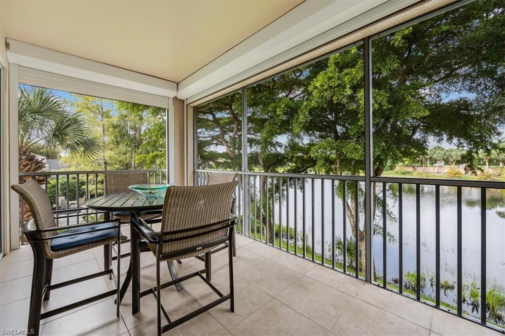 a view of a chairs and table in the balcony