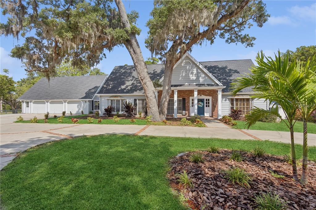 a front view of house with yard and green space