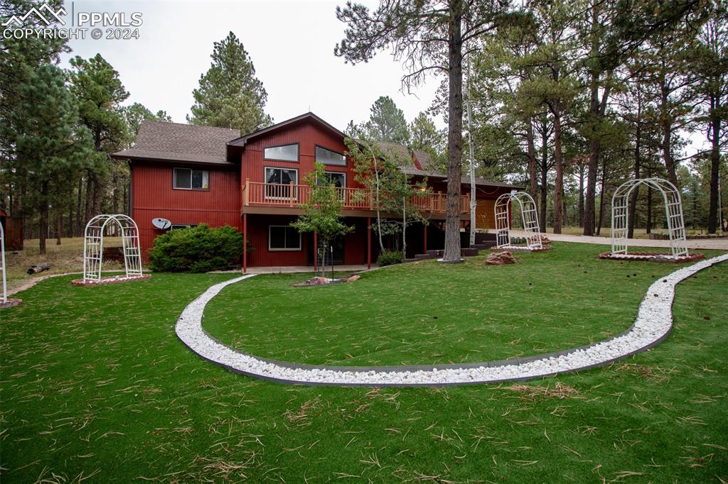 front view of a house with a yard