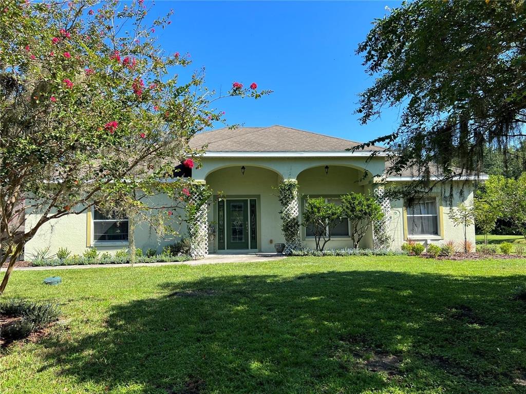 a front view of a house with a yard