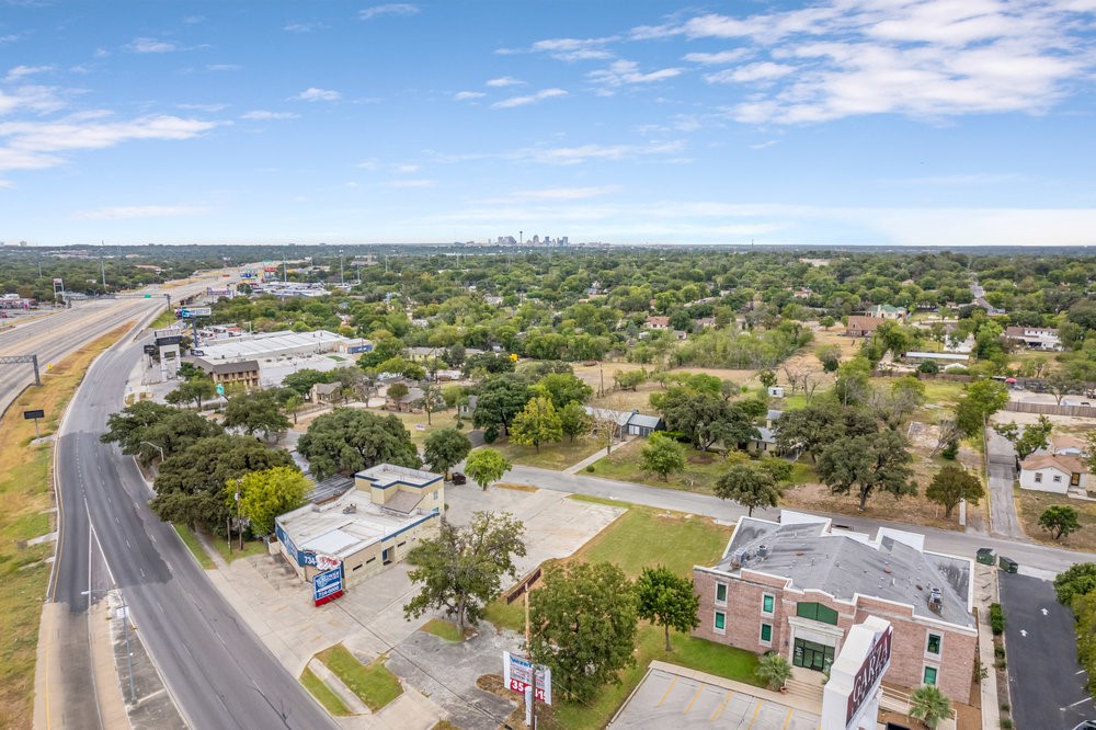 an aerial view of residential houses with outdoor space