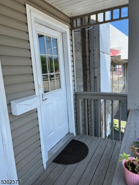 a view of a house with a door and wooden floor