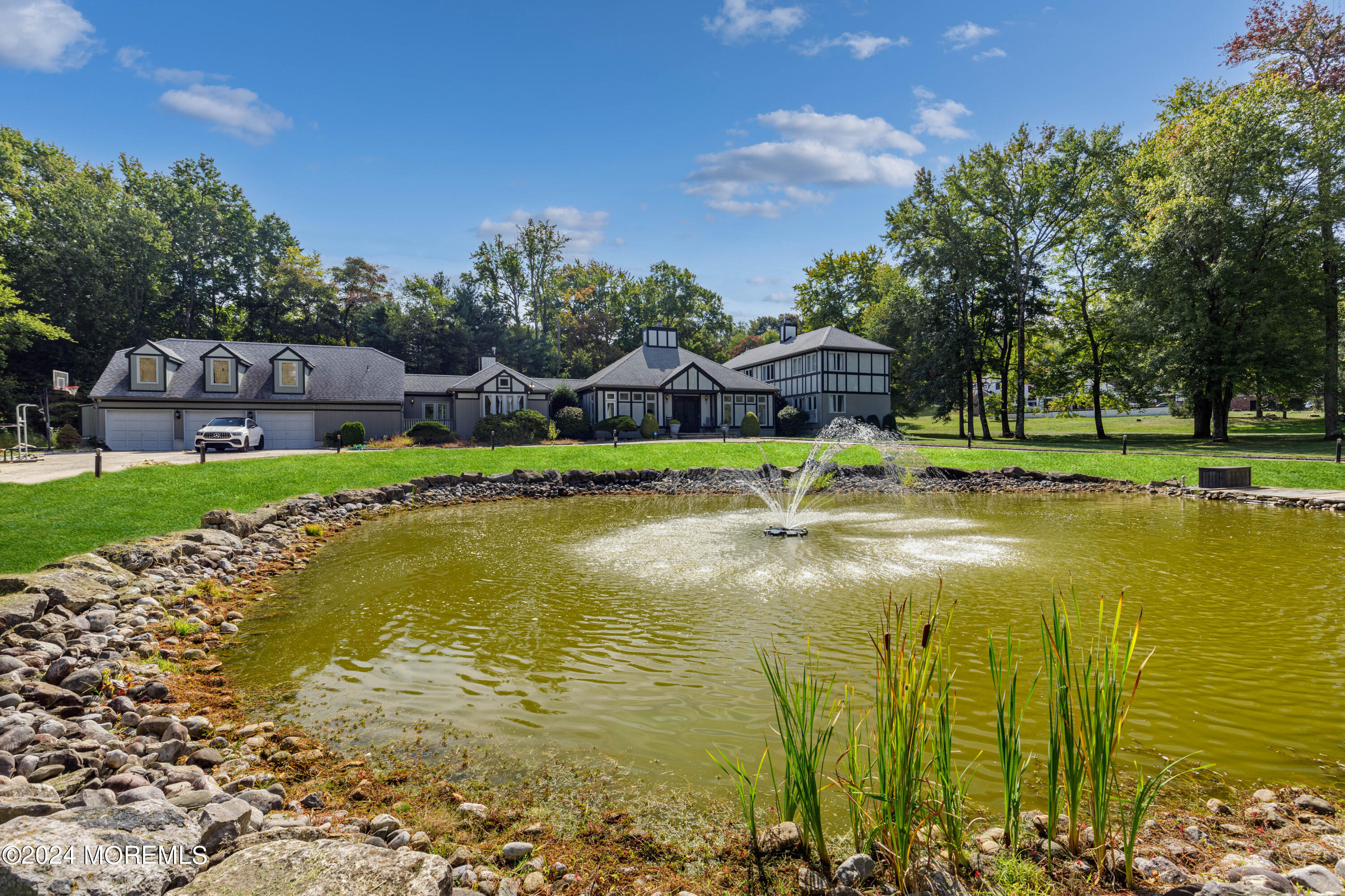 a swimming pool with outdoor seating and yard