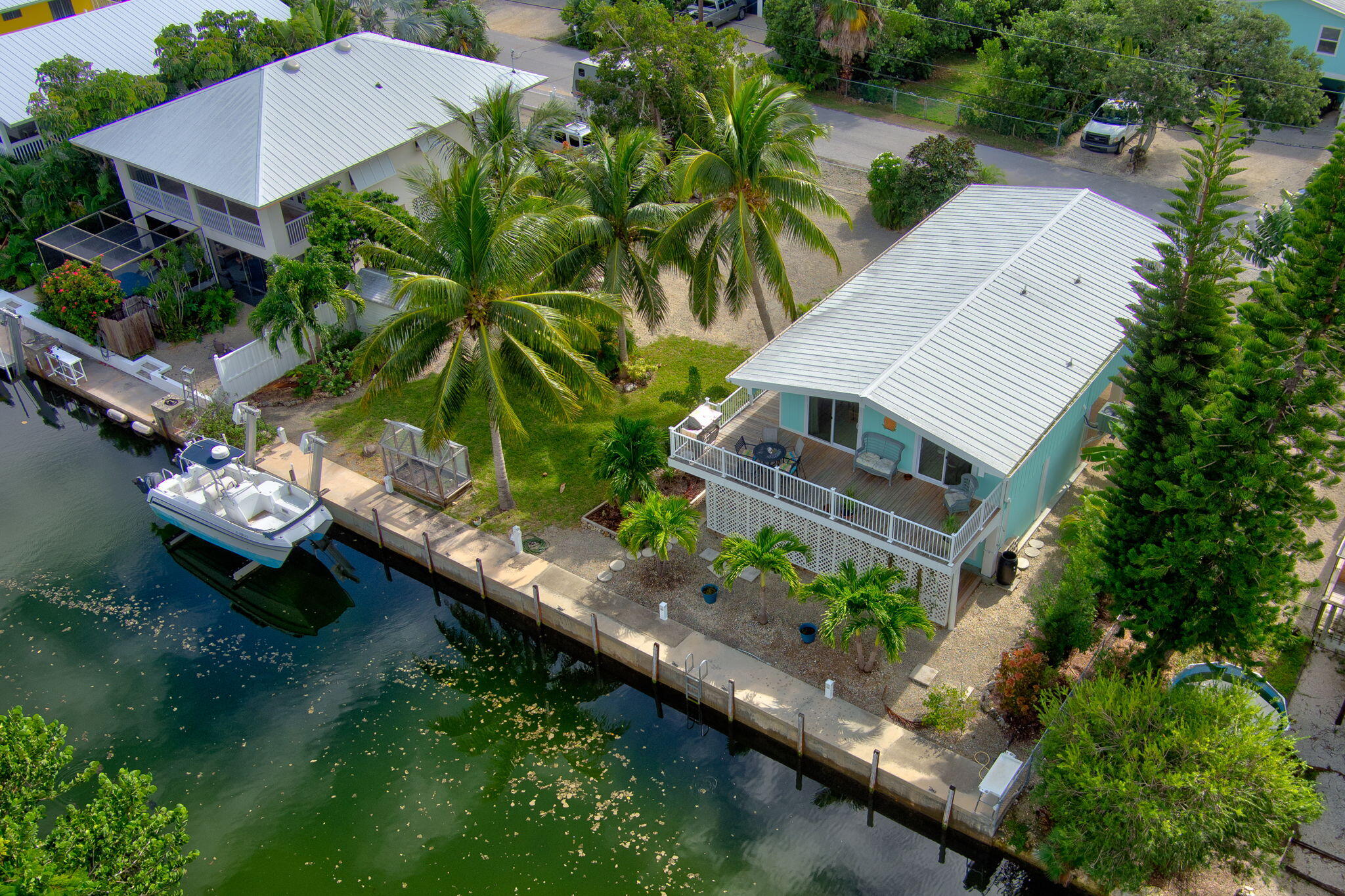 an aerial view of a house with garden space and sitting area