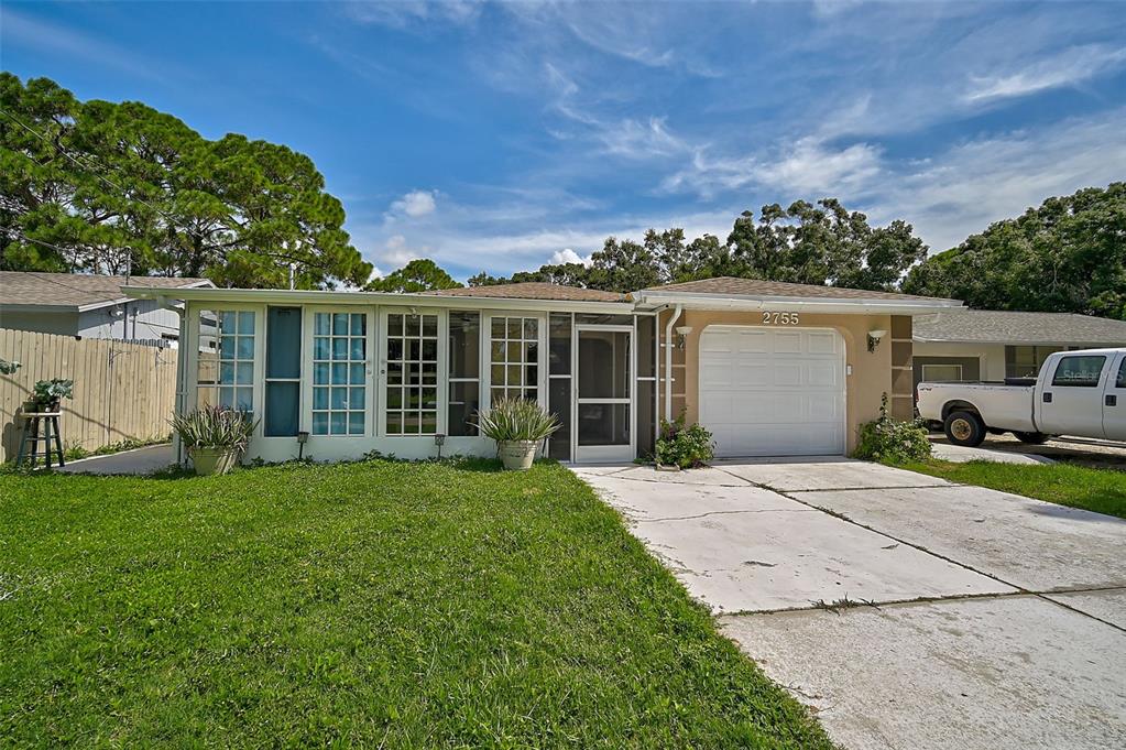 front view of a house with a yard