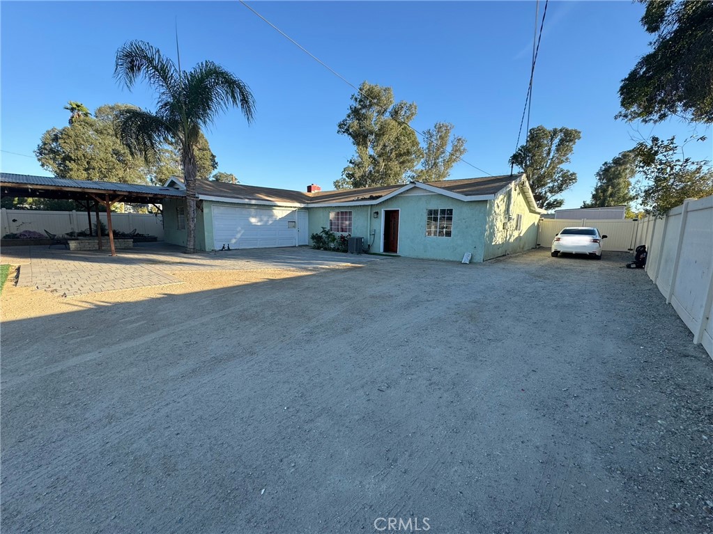 a front view of a house with a yard and a garage