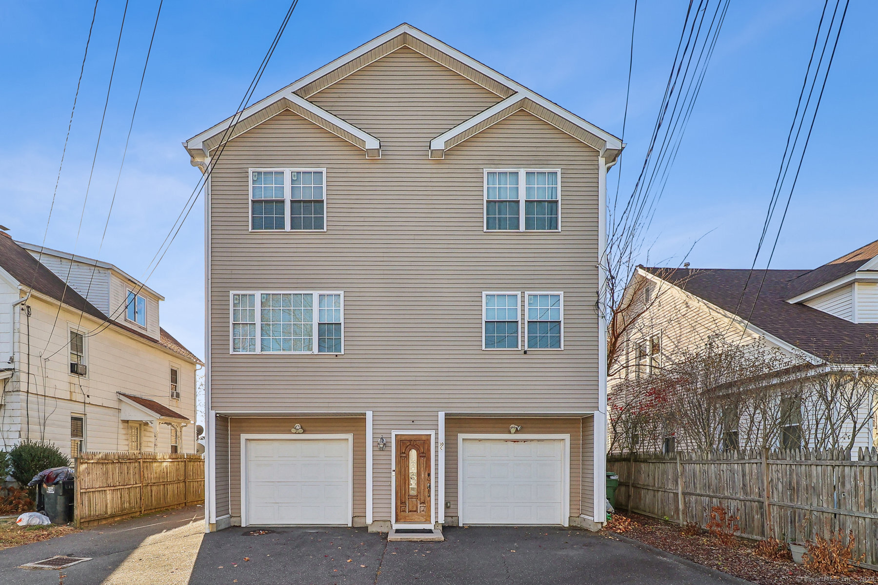 a front view of a house with parking