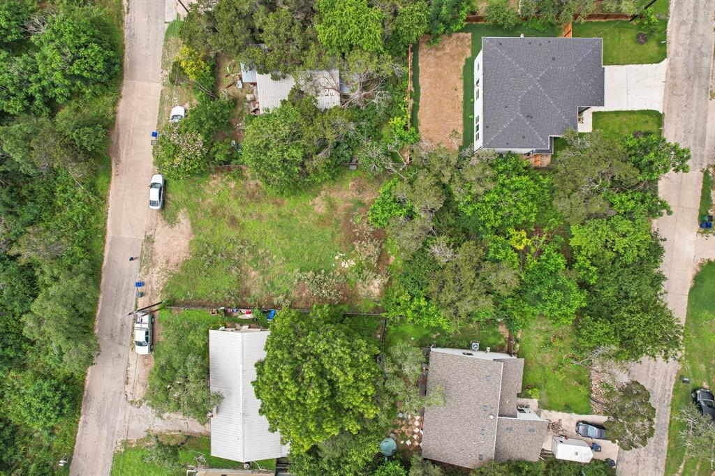 an aerial view of a house with yard and outdoor seating