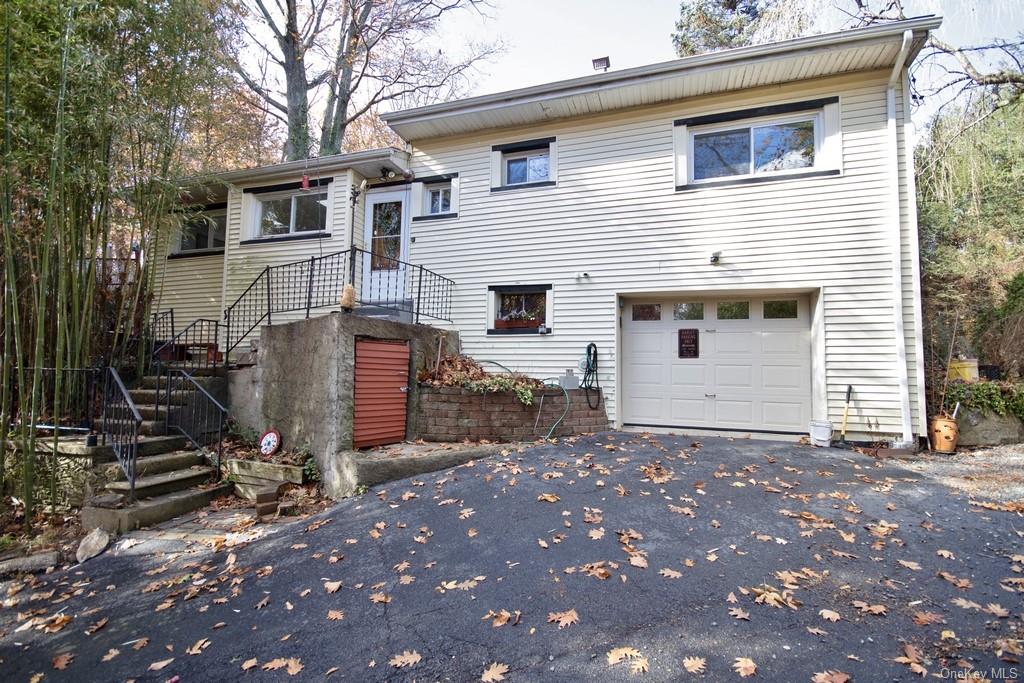 View of front of home featuring a garage