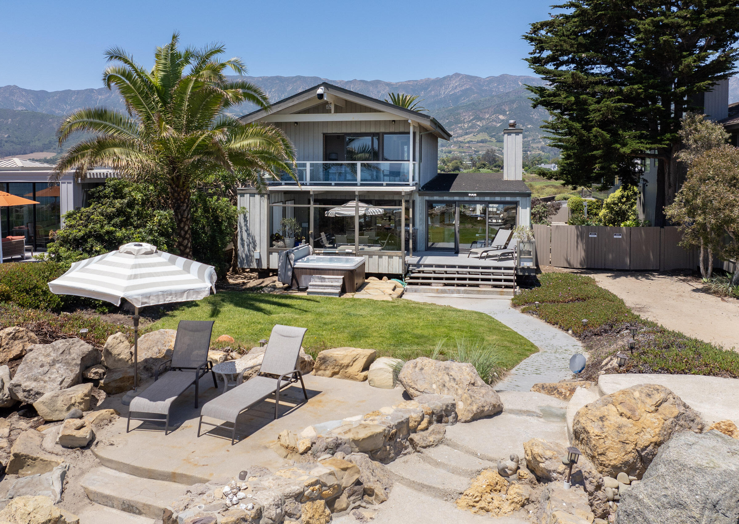 a view of a house with swimming pool and porch