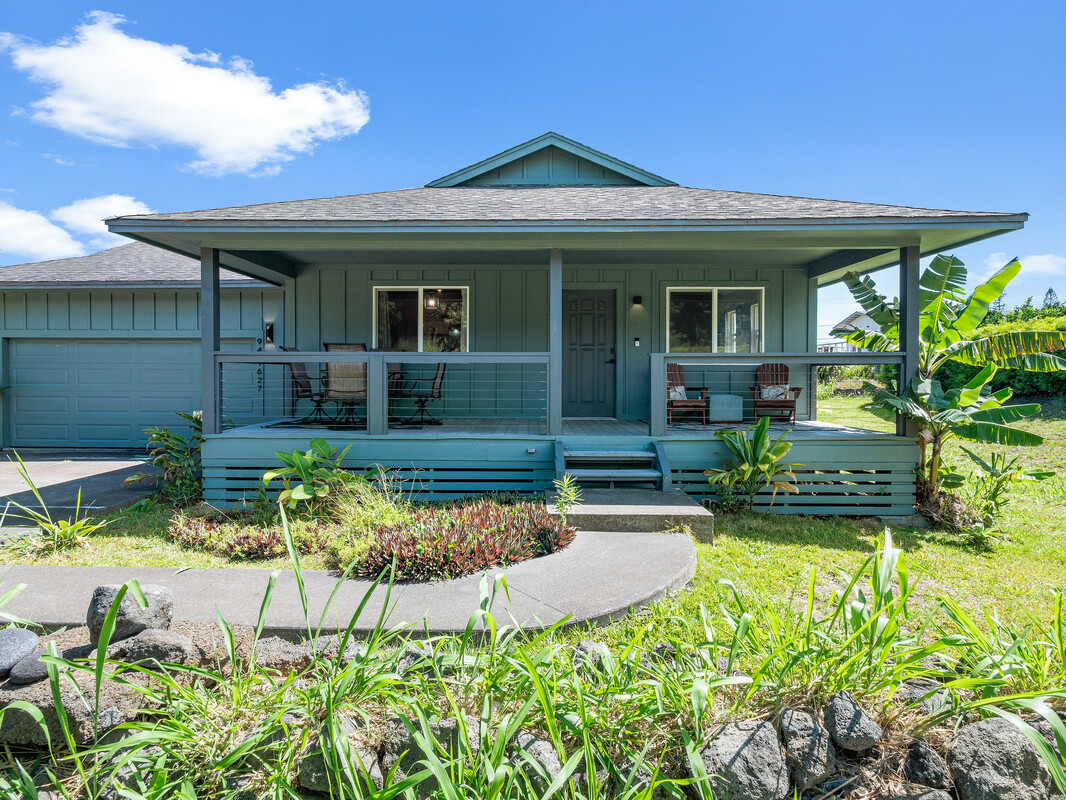 front view of a house with a yard