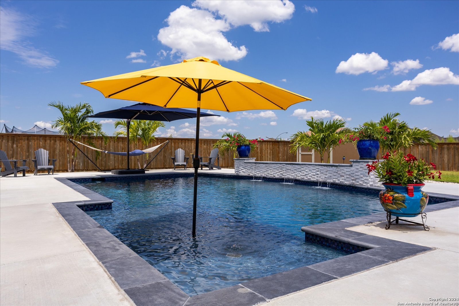 a view of a backyard with a patio