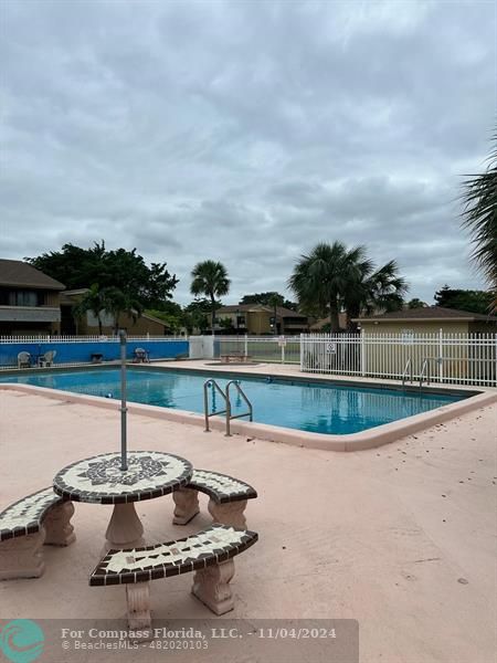 a view of a swimming pool with a chair