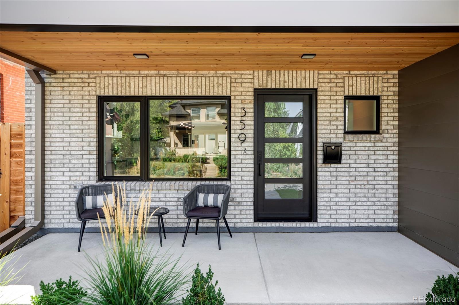 a view of a patio with a table and chairs