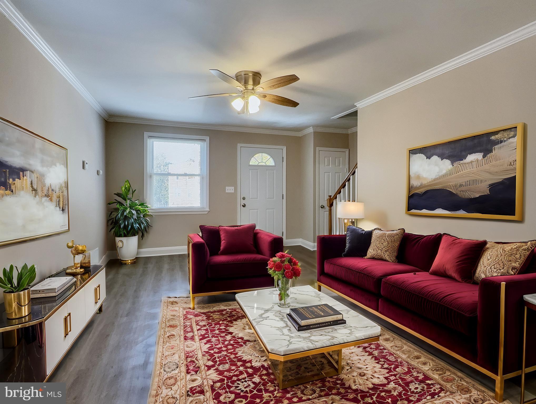 a living room with furniture a rug and a chandelier