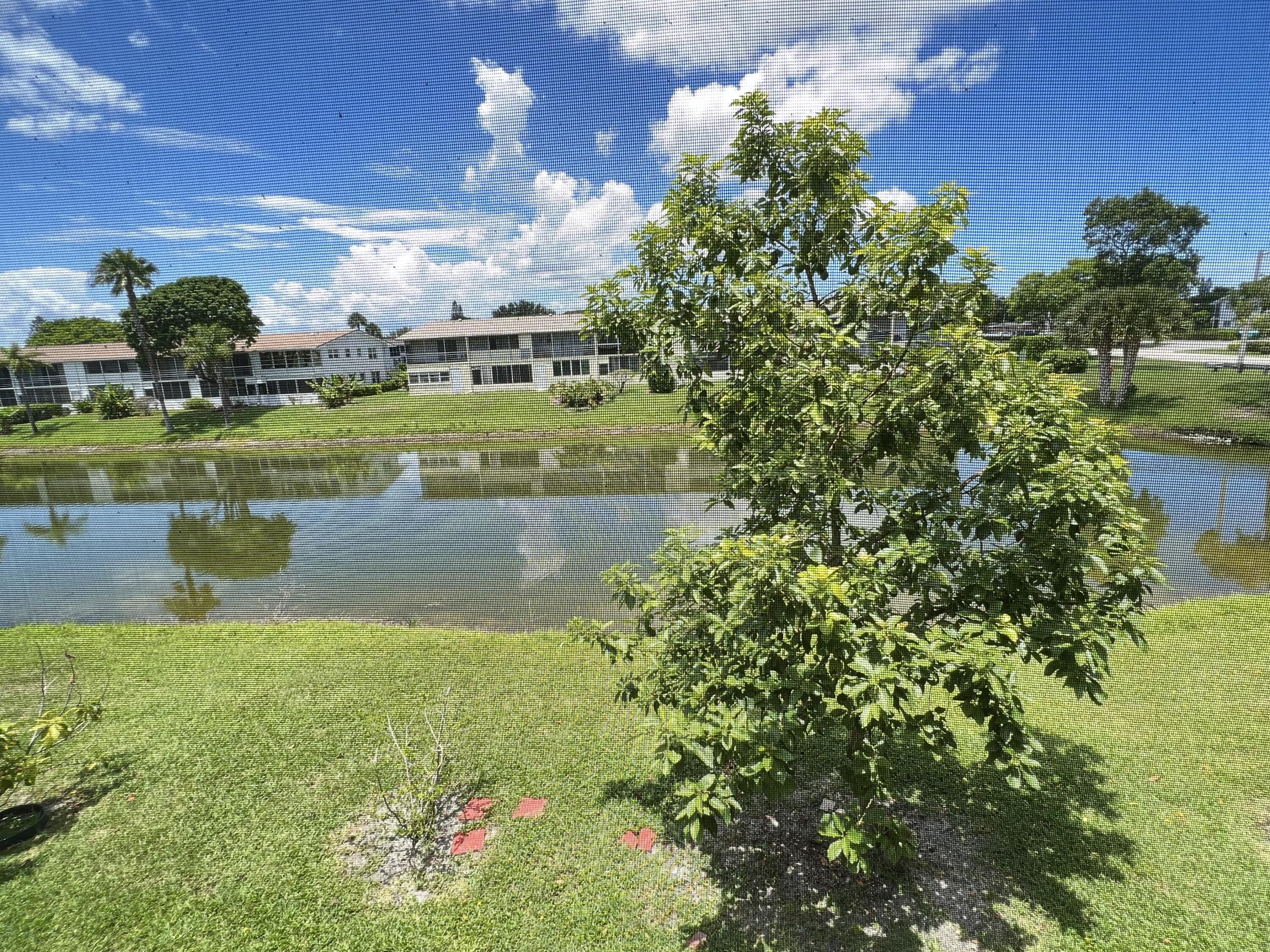 a view of a lake with a building in the background