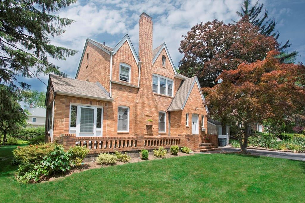 front view of a house with a yard