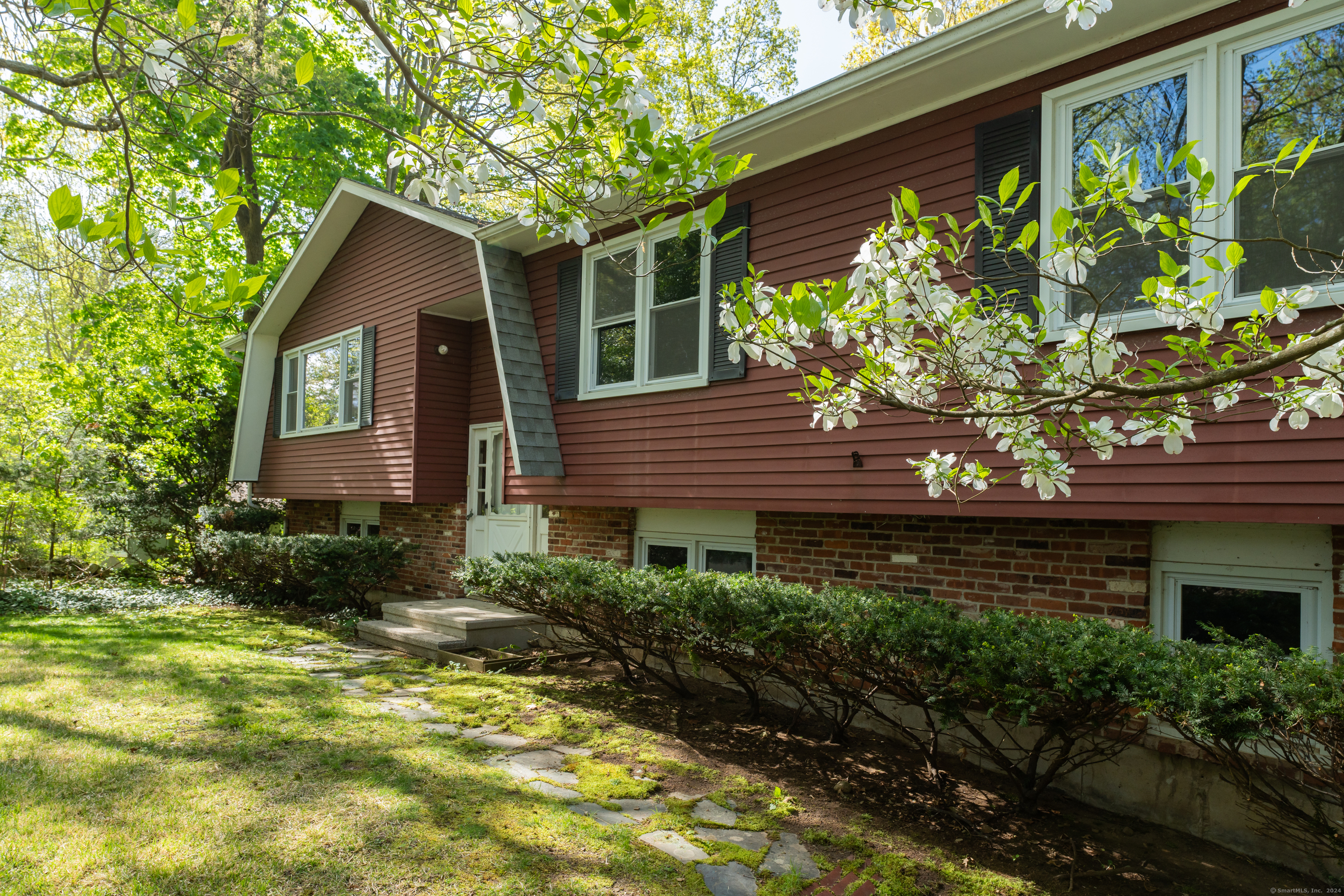 a house view with a garden space