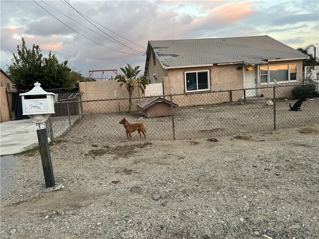 a view of a yard and front view of a house