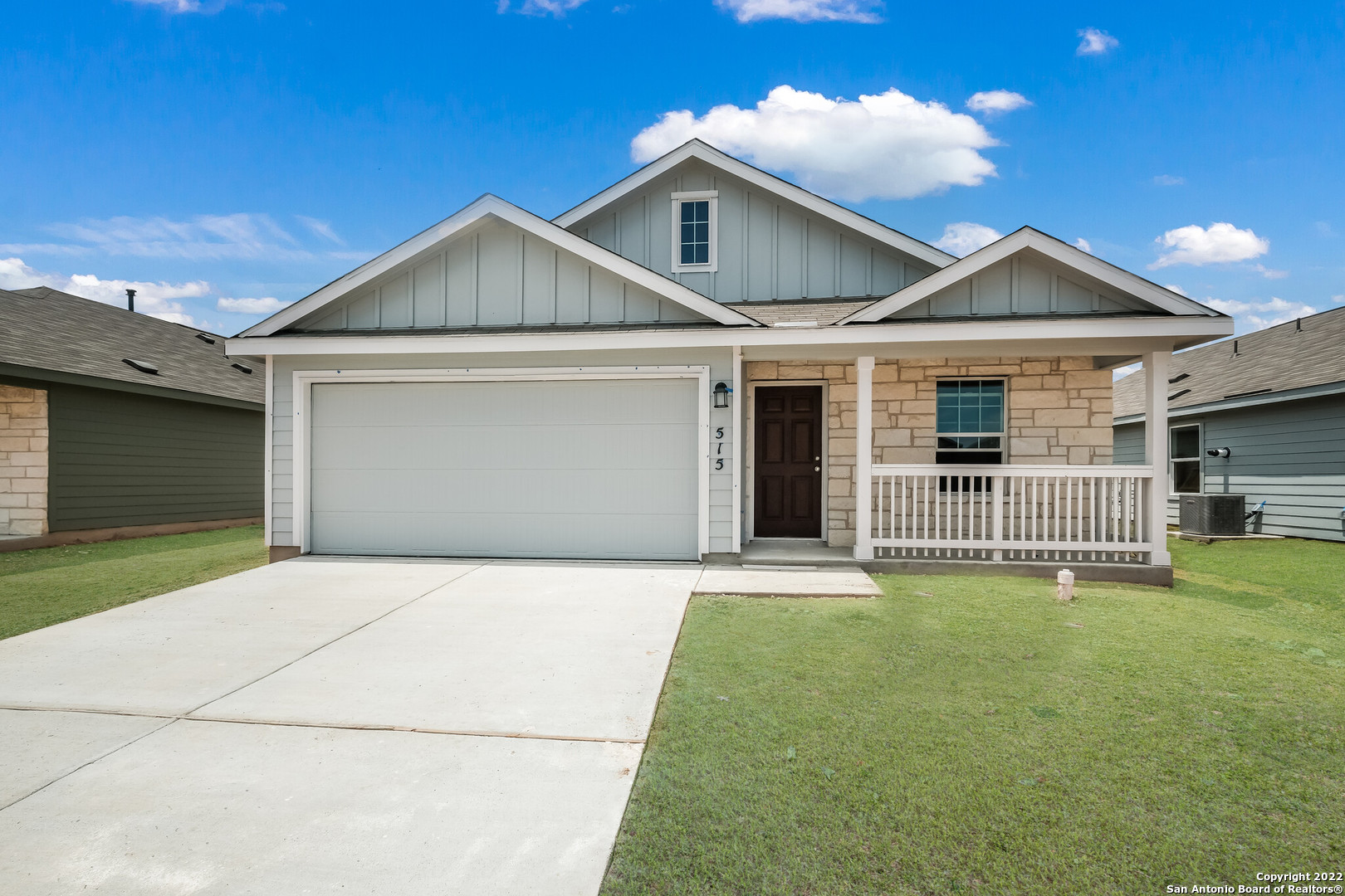 a front view of a house with yard