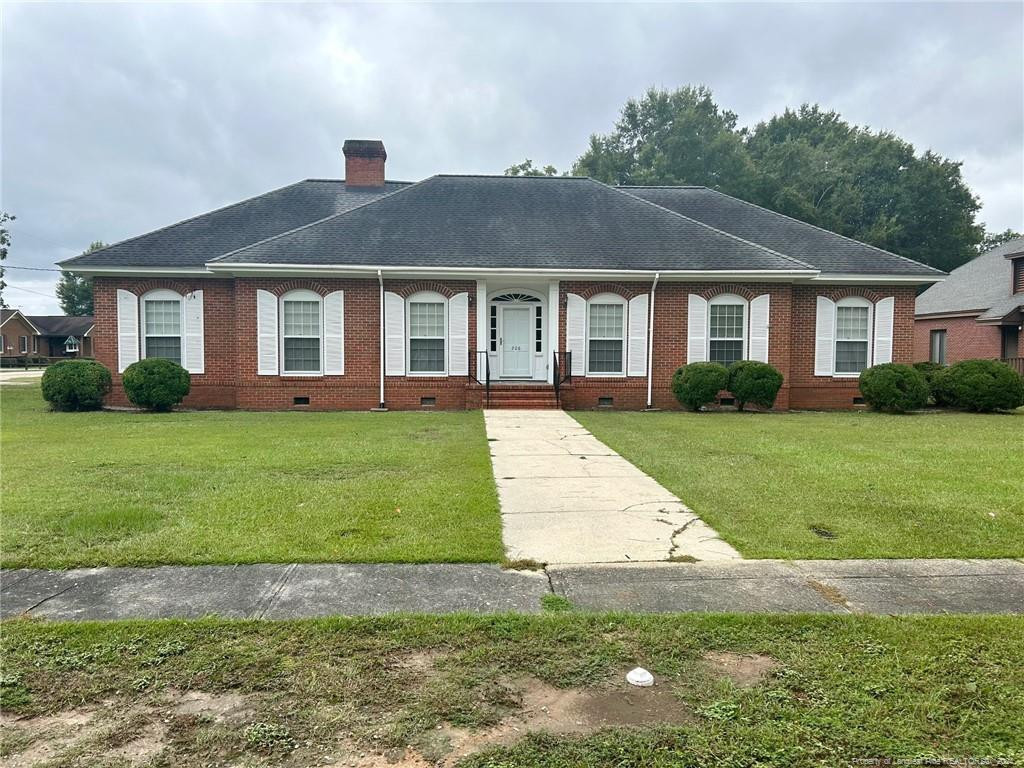 a front view of a house with a yard