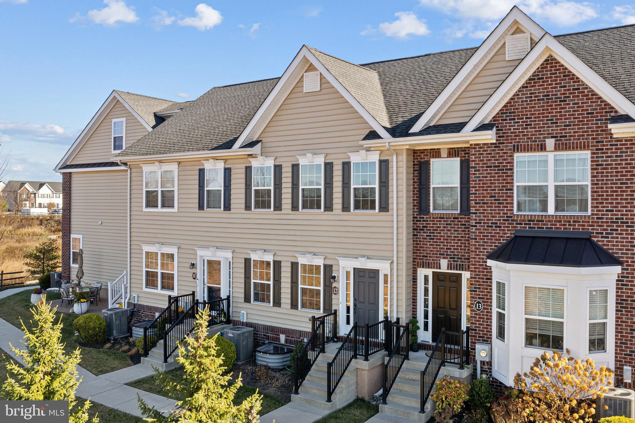 a front view of a house with outdoor seating