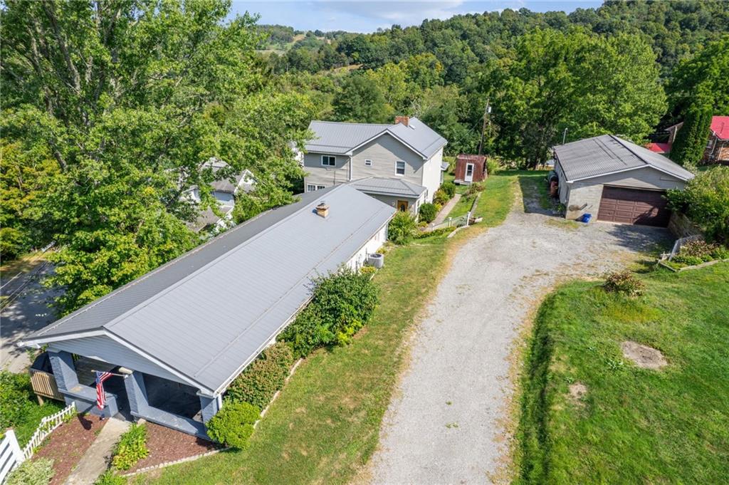 an aerial view of a house with a garden