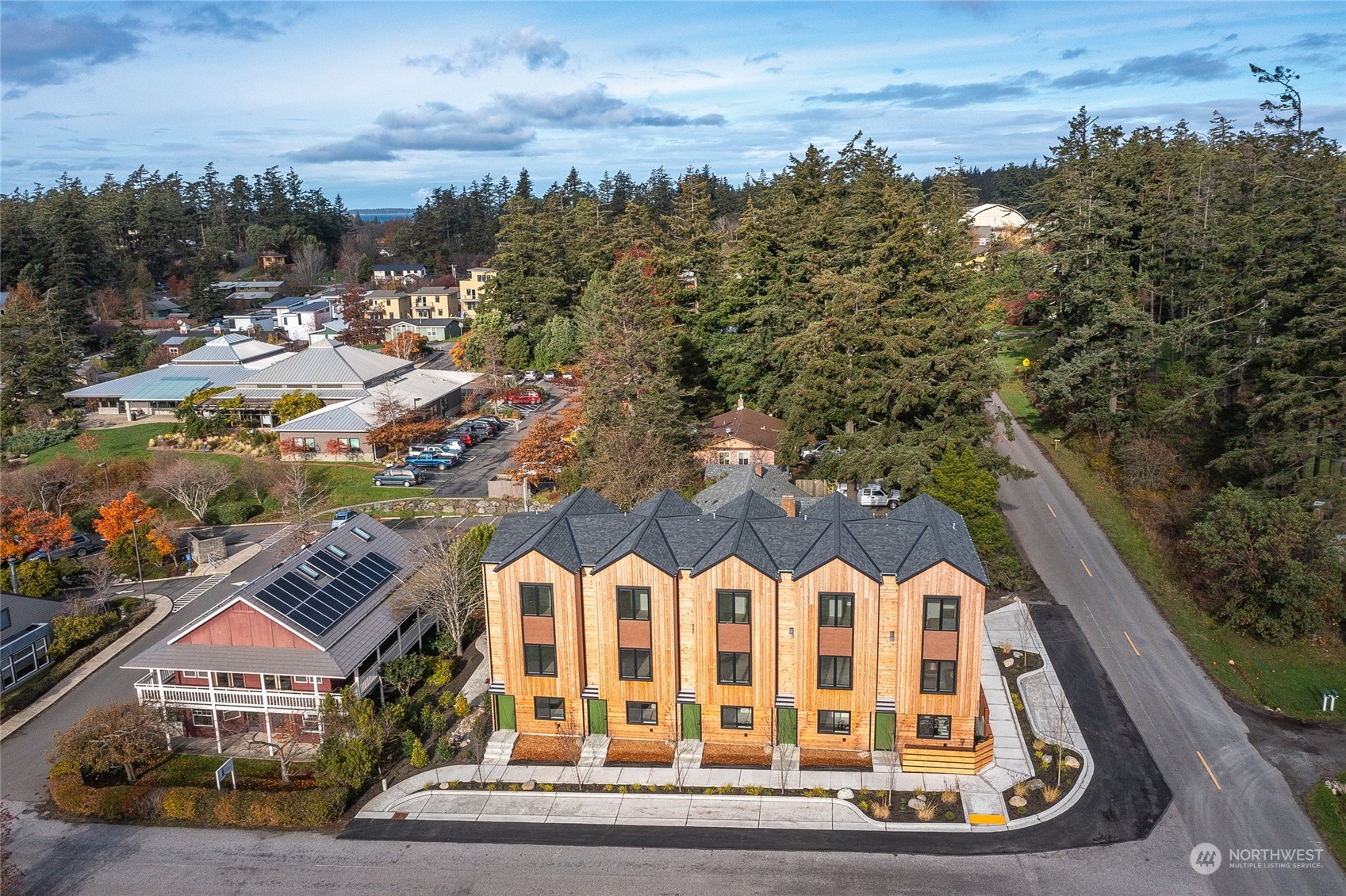 an aerial view of residential houses with outdoor space