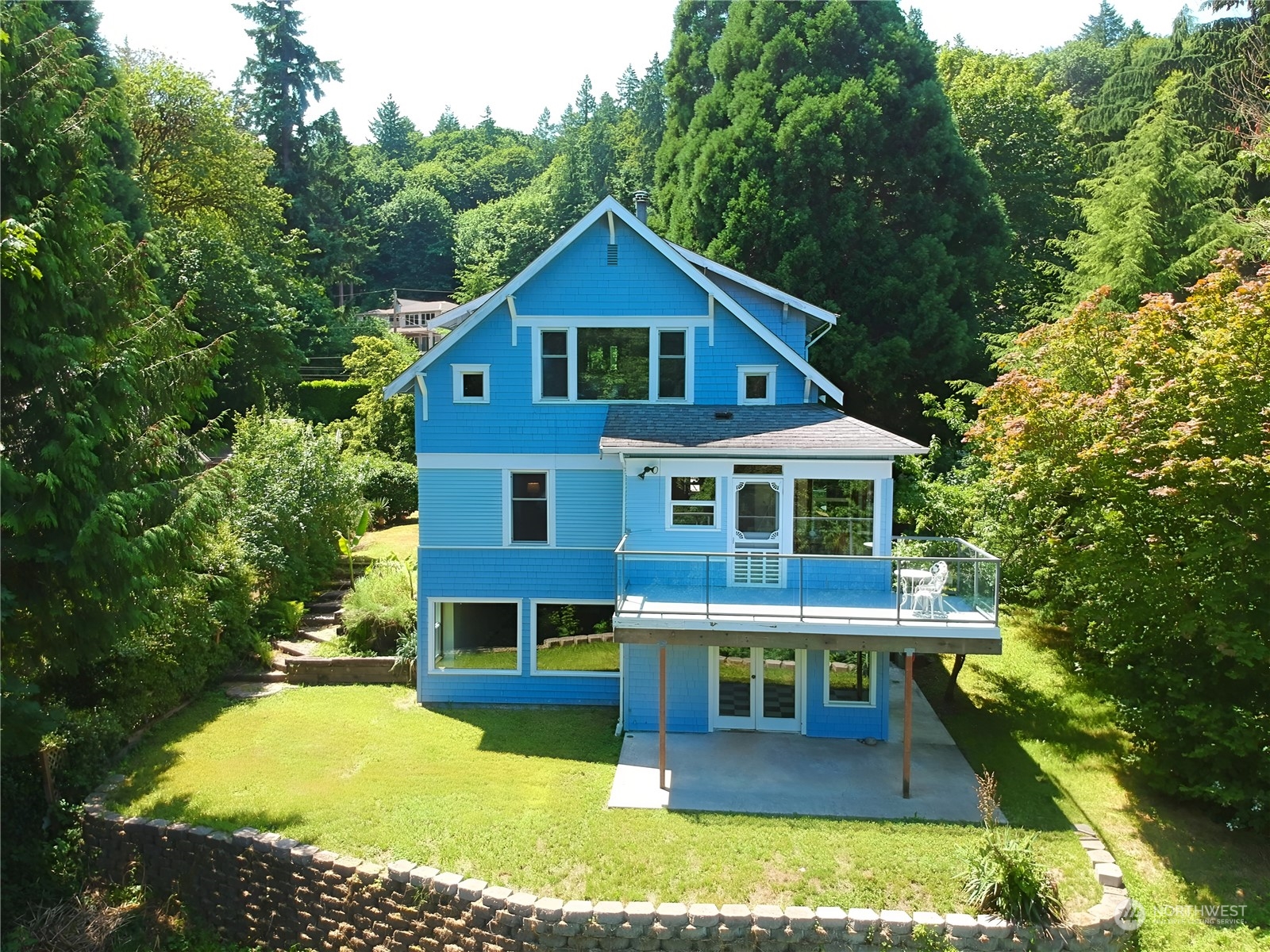 a aerial view of a house with yard porch and sitting area