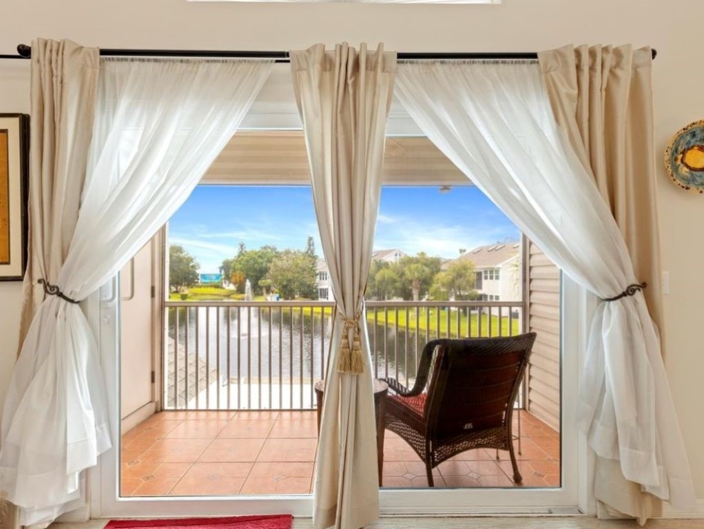 a view of a chair and table in the balcony