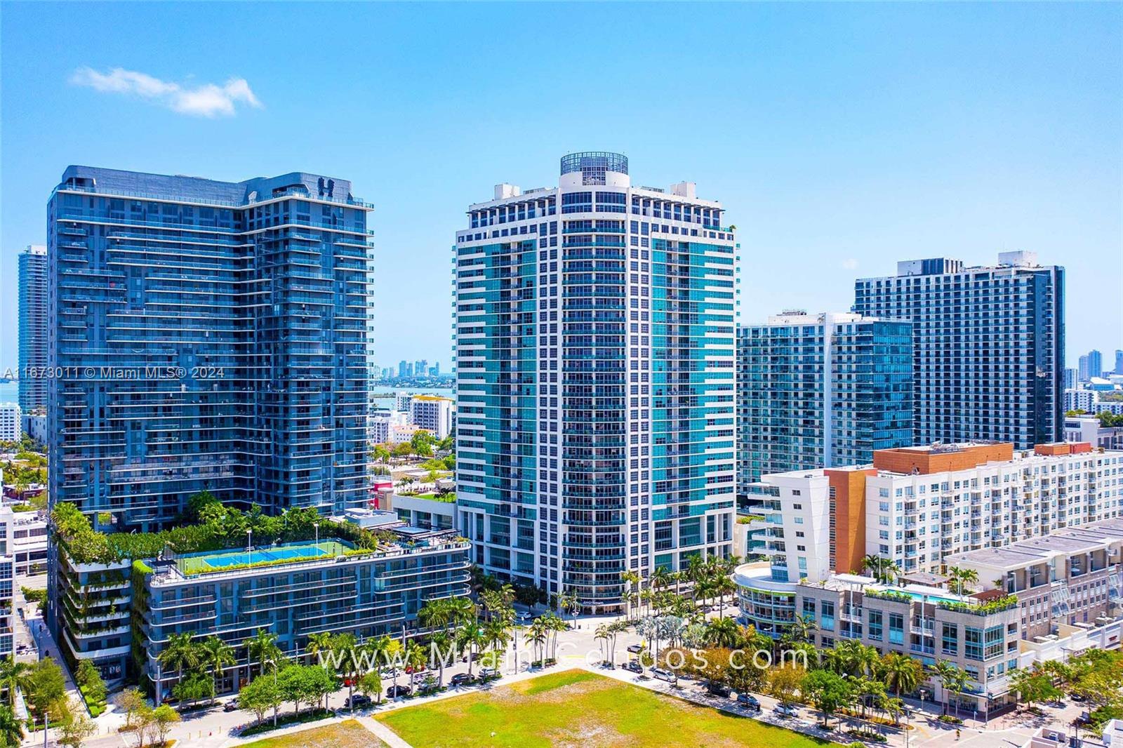 a view of a city with tall buildings