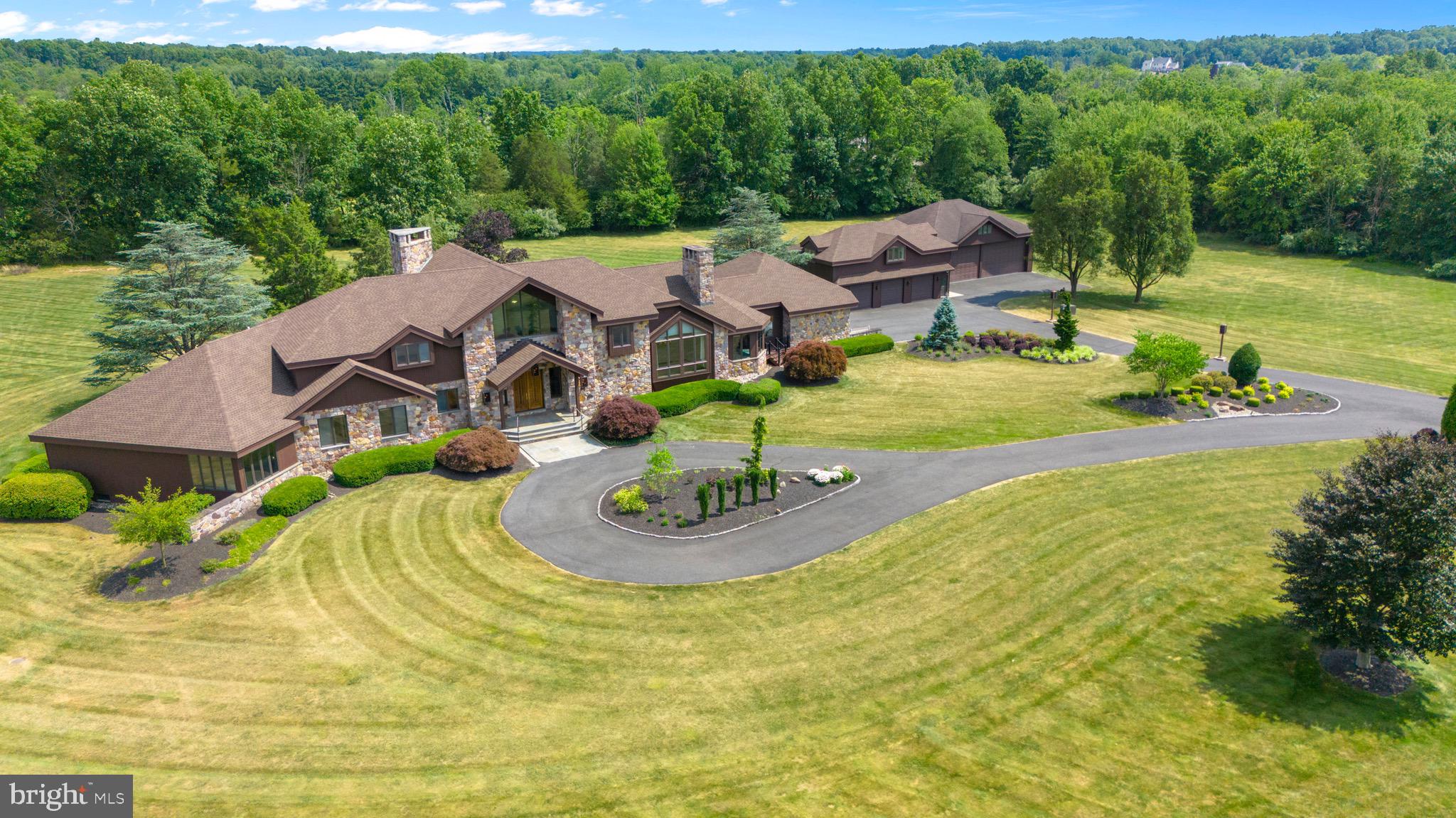 an aerial view of a house with garden space and street view