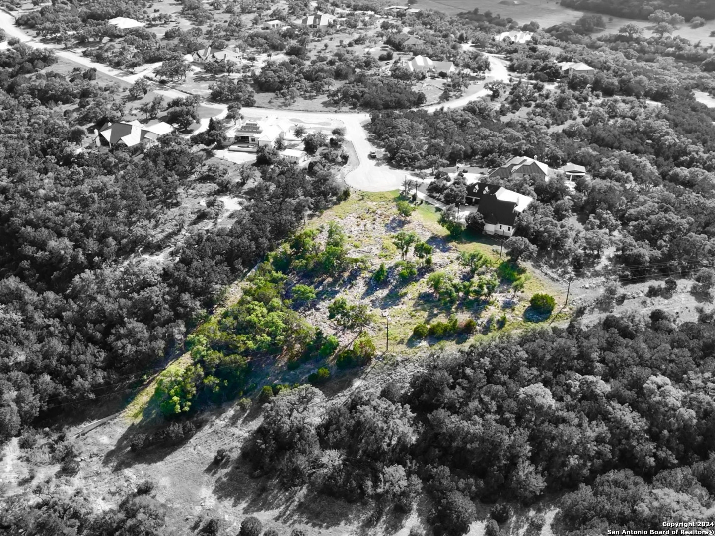 an aerial view of house with yard