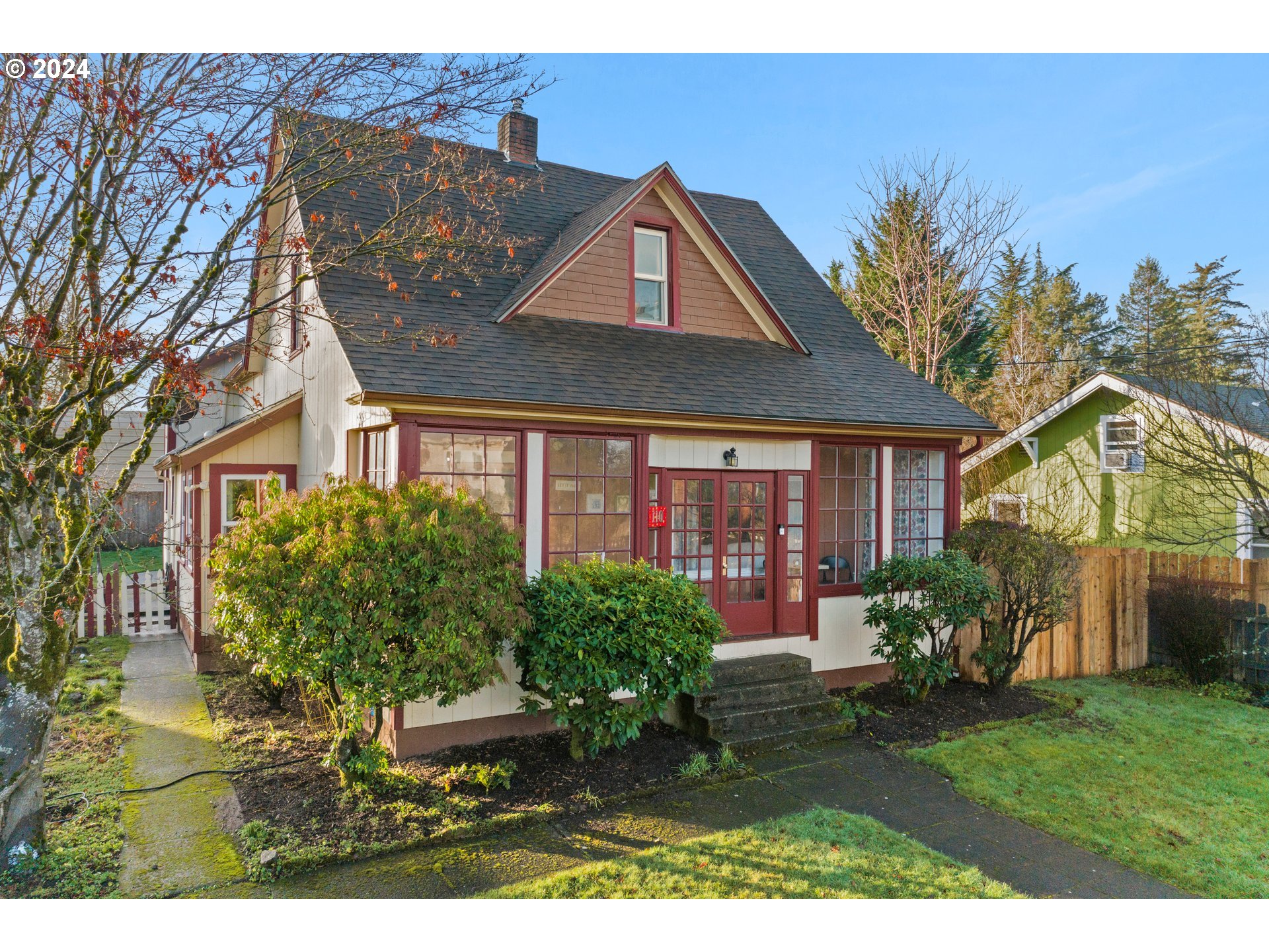 a front view of a house with garden